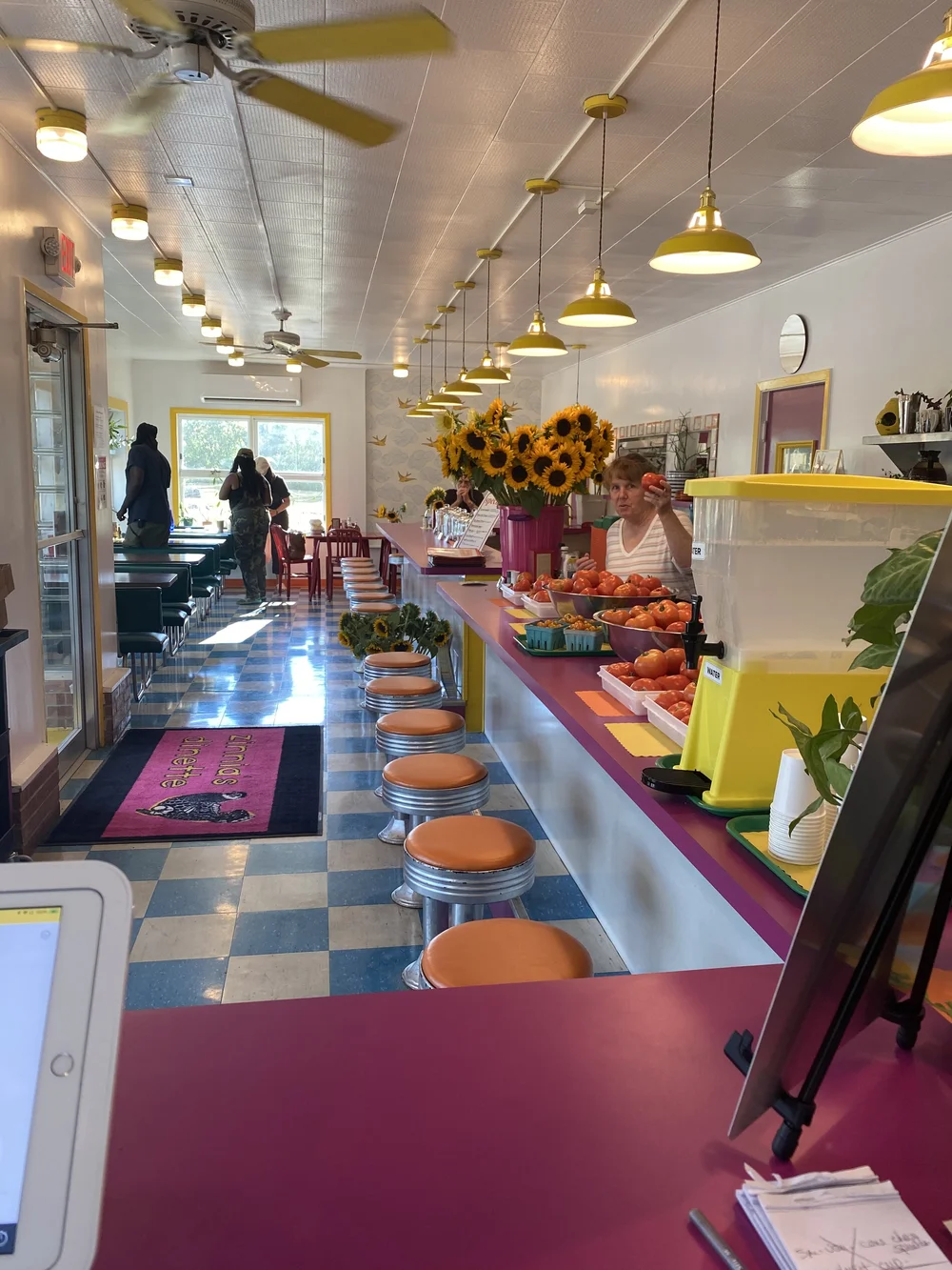 Looking down the counter with sunflowers at the far end